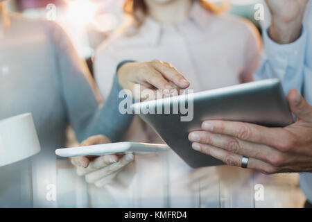 Close up business people using digital tablets Banque D'Images