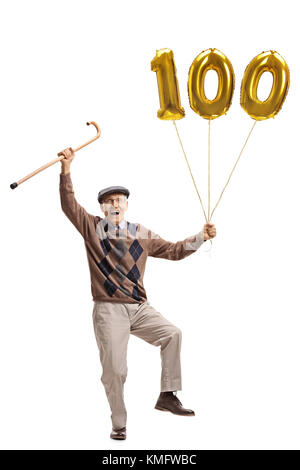 Portrait d'une très grande joie hauts avec une canne et un nombre d'or centaines balloon isolé sur fond blanc Banque D'Images