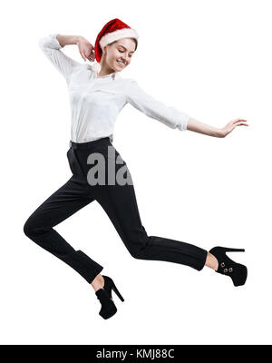 Young businesswoman jumping in christmas hat isolated on white. Banque D'Images