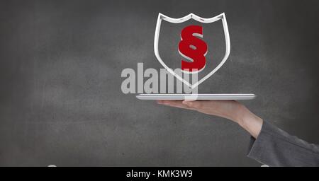 Digital composite of Hand holding tablet avec bouclier section icône symbole Banque D'Images