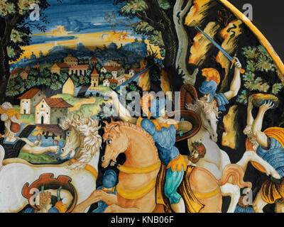 Un plat de maiolica de 1540 à 45 représentant une scène de bataille, reflétant le style artistique de la Renaissance, attribué à Giulio Romano d'après la gravure de Marco Dente, faisant partie d'une collection de musée. Banque D'Images