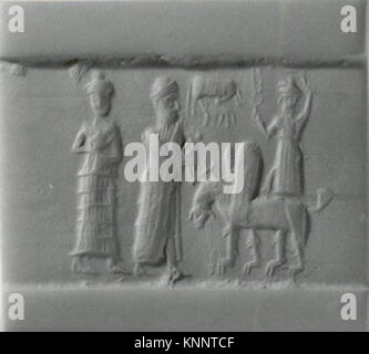 Ce vieux sceau cylindrique babylonien, datant du XVIIIe au XVIIe siècle av. J.-C., est fait d'hématite et provient de la Mésopotamie. Il mesure 1,1 pouces (2,79 cm) de longueur. Banque D'Images