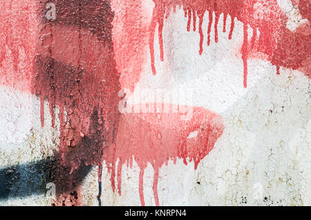 Résumé rouge et noir plus de fragment graffiti ancien mur de béton Banque D'Images