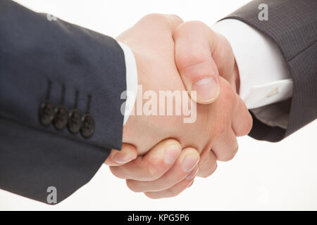 Businessmen shaking hands Banque D'Images