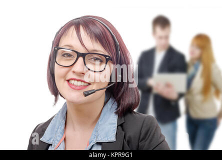 Close-up portrait of smiling young woman with headset Banque D'Images