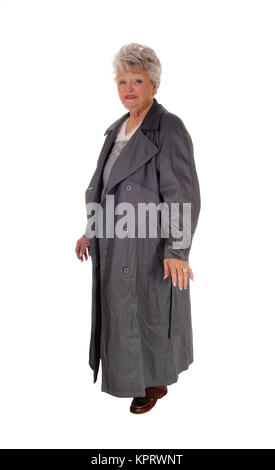 Hauts femme debout dans un long manteau. Banque D'Images