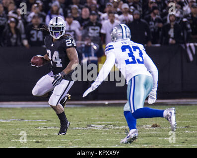 Oakland, California, USA. 17th Dec, 2006. St. Louis Rams defensive back  Ronald Bartell (24) runs with ball intended for Oakland Raiders wide  receiver Johnnie Morant (19) on Sunday, December 17, 2006, in