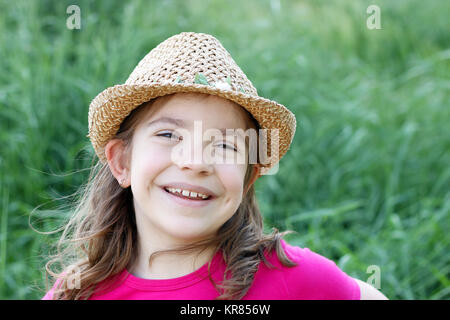 Happy little Girl with hat portrait Banque D'Images