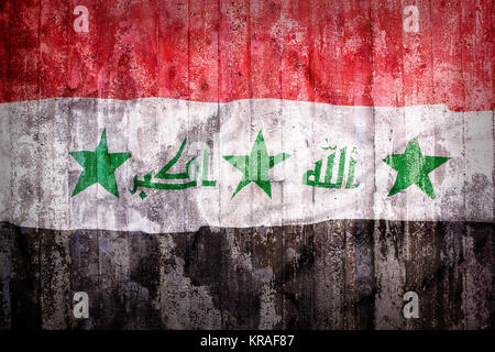 Grunge style de l'Irak drapeau sur un mur de brique pour le fond Banque D'Images