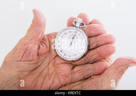 Senior Woman Holding Chronomètre Banque D'Images