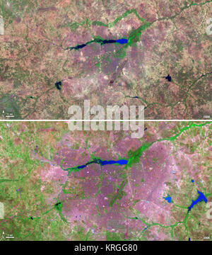 Les pays d'Afrique de l'ouest enclavé du Burkina Faso a connu une augmentation de 200 p. 100 de la population urbaine entre 1975 et 2000. En conséquence, la région de la capitale Ouagadougou a augmenté 14 fois au cours de cette période. Ces images Landsat montrent l'expansion de la ville vers l'extérieur de son centre dans les deux décennies entre 1986 et 2006. Le 18 novembre 1986, le satellite Landsat 5 a acquis cette image de la capitale. Cette image en fausses couleurs montre la végétation dans l'alose de vert et de gris, l'eau dans différentes teintes de bleu, et les zones urbaines en rose et violet. La piste de l'aéroport de la ville peut être vue comme un long Banque D'Images