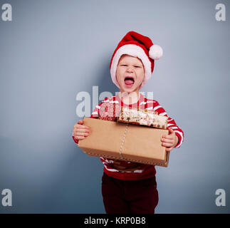 Portrait of boy with christmas gifts Banque D'Images