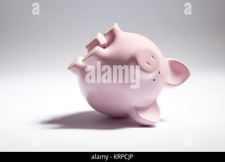 Pink piggy bank à l'envers Banque D'Images