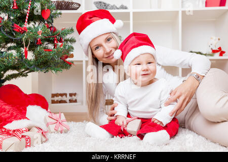 Mother with baby boy celebrating Christmas Banque D'Images