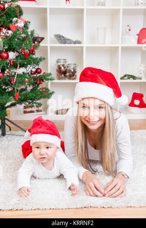 Mother with baby boy celebrating Christmas Banque D'Images