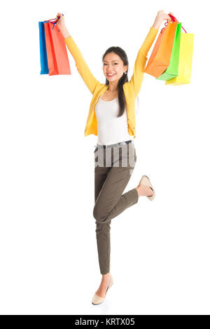 Happy Asian female with shopping bags Banque D'Images