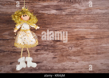 Vintage toy angel figurine on wooden table Banque D'Images