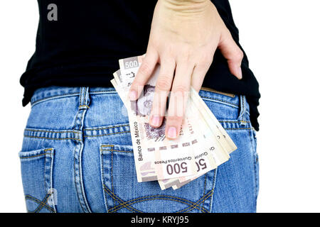 Coquille d'une pile d'argent dans la poche arrière du jeans Banque D'Images