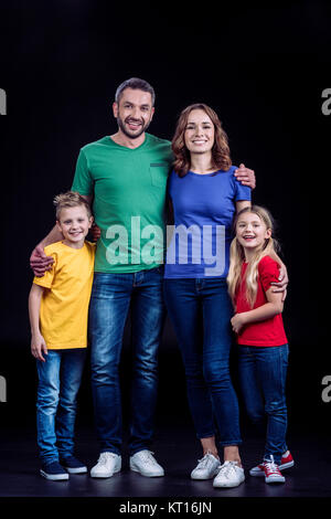 Family smiling at camera Banque D'Images