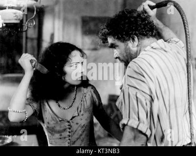 Une photo du film de 1930 *Hell Harbor*, représentant une scène dramatique de ce premier film hollywoodien. Le film, un film muet, se déroule dans un environnement tropical et dépeint des conflits humains et naturels intenses. Banque D'Images