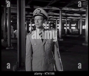 Une capture d'écran de la bande-annonce de 'Panic in the Streets' (1950), réalisé par Elia Kazan, représentant un moment tendu de ce drame criminel se déroulant à la Nouvelle-Orléans. Banque D'Images