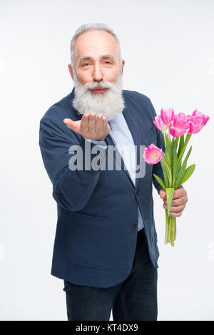 Man avec des tulipes Banque D'Images