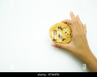 Woman's hand holding chocolate chip cookies Banque D'Images