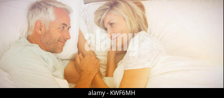 Senior man and woman Lying in Bed Banque D'Images