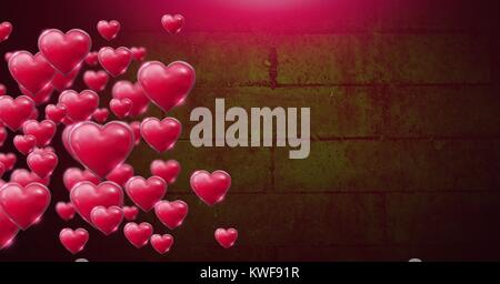 Les cœurs de Saint-Valentin brillants et pétillantes sur un mur vert Banque D'Images