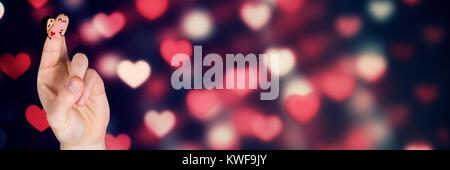 Les doigts de la Saint-Valentin aiment couple et bokeh coeur lumières briller Banque D'Images