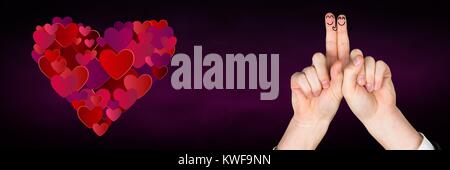 Les doigts de la Saint-Valentin aiment le couple et les coeurs Banque D'Images