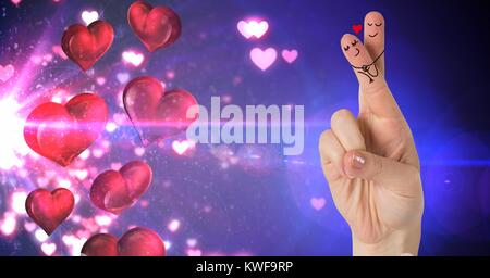 Les doigts de la Saint-Valentin aiment couple et les coeurs flottant de la source de lumière Banque D'Images