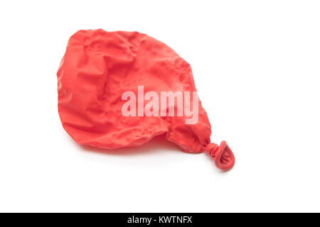 Un ballon rouge dégonflé Banque D'Images