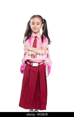 1 School Kid Girl Student Arms Crossed Standing Fond blanc Banque D'Images