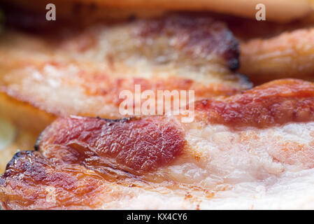 Les tranches de bacon frit macro Banque D'Images