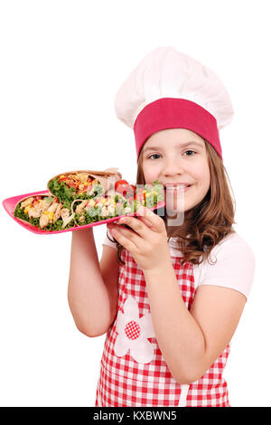 Happy little girl cook avec burritos Banque D'Images