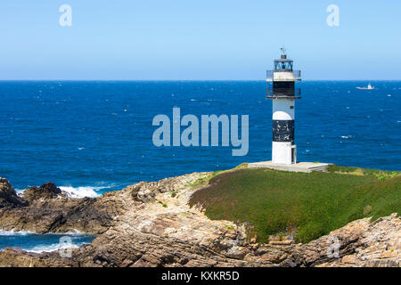 Illa Pancha à Ribadeo, Espagne, une île magnifique avec deux phares gardant l'estuaire d'Ot qui délimite la frontière entre la Galice et les Asturies. Banque D'Images