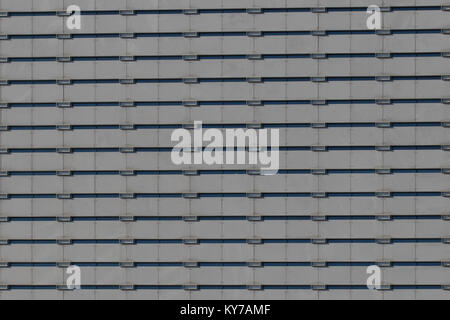 Image d'arrière-plan d'une façade bureau gris avec de petites fenêtres. Banque D'Images