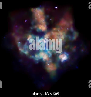 Cette image capture la scène dramatique dans la nébuleuse de Tarentule (30 Doradus), montrant la formation d'étoiles dans cette région active de l'espace. La photographie, prise par l'Observatoire de rayons X de Chandra, révèle les processus complexes de la naissance stellaire. Banque D'Images