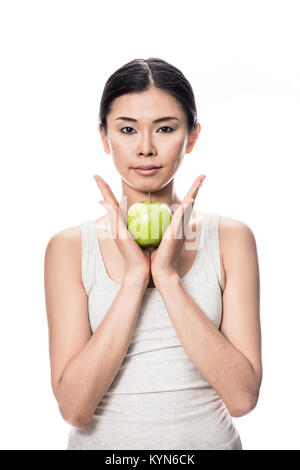 Young Asian woman holding apple Banque D'Images