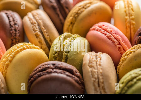 Gâteau macarons sucrés comme arrière-plan, des couleurs pastel Banque D'Images