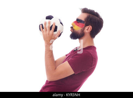 Amateur de soccer kissing un ballon de foot Banque D'Images