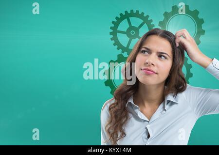 Femme confus de rayer sa tête jusqu'à la avec cogs Banque D'Images