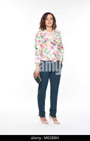 Pretty brown-haired woman posing in divers vêtements Banque D'Images