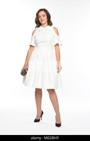 Pretty brown-haired woman posing in divers vêtements Banque D'Images