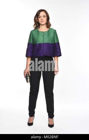 Pretty brown-haired woman posing in divers vêtements Banque D'Images