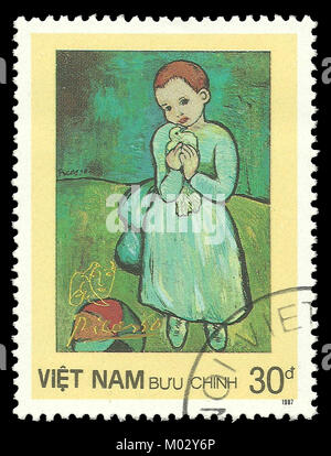 Vietnam - timbres en 1987 : Edition de couleur sur l'art, la peinture montre enfant tenant une colombe de Pablo Picasso Banque D'Images