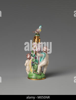 Cette photographie représente des garçons à une fontaine, probablement pris dans un cadre urbain ou public. L'image capture un moment de jeu et de vie quotidienne, offrant un aperçu des pratiques sociales ou culturelles. Banque D'Images