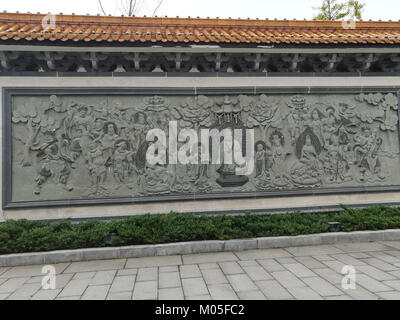 Le mur en relief de Bouddha au temple Miyin présente des sculptures complexes représentant des scènes d'enseignements bouddhistes. Cet artefact culturel et religieux est une partie importante du patrimoine architectural du templeâ€™s. Banque D'Images