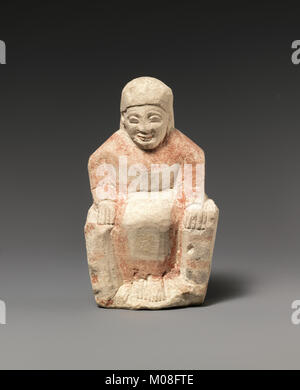 Cette statuette en calcaire représentant une figure féminine assise illustre l'art sculptural antique, la sculpture détaillée et les proportions, conservés dans la collection MET. Banque D'Images